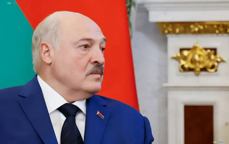 Alexander Lukashenko in a blue suit with the Belarus flag in the background, announces secret talks with representatives of Zelensky