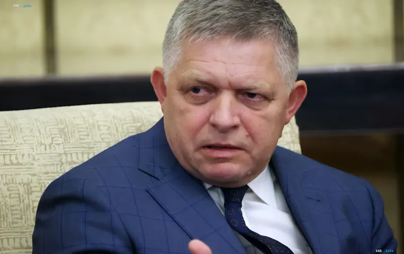 Robert Fico in a blue suit discussing the blocking of aid to Ukraine at the NATO summit