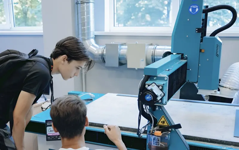 KAU students working on a milling machine in Ukraine's first aviation modeling lab for UAV production