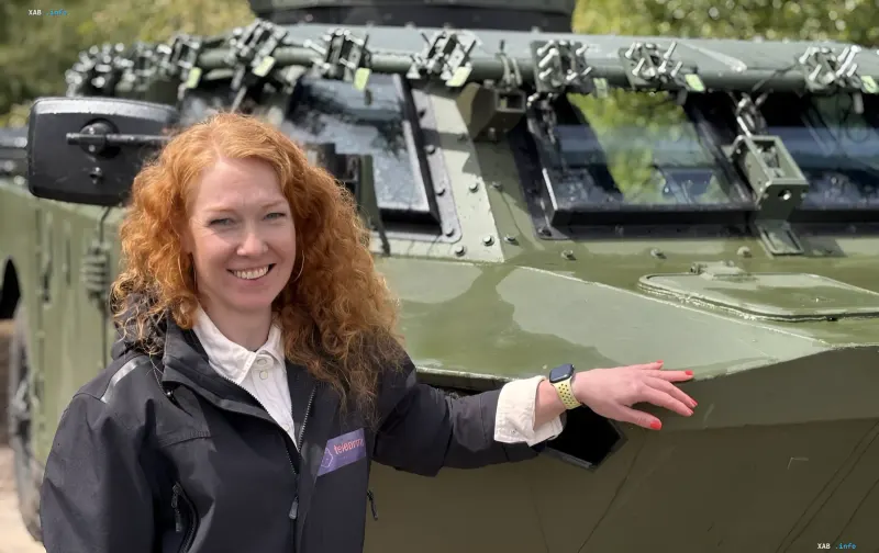 Representative of Estonian company Telearmy next to a BRDM equipped with a remote control system