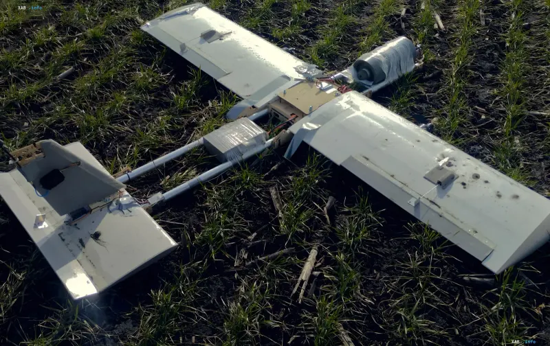 Prototype of a fiber-optic controlled strike drone, similar to 'Molniya', lying on grass