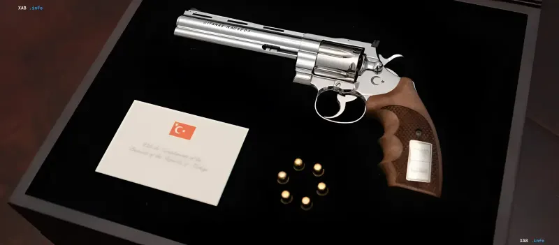 Silver revolver with Turkish crescent and star, engraved 'QITANAS NAUSEOA', presented in a gift box with letter from President of Turkey — Erdogan’s diplomatic gift to NATO leaders