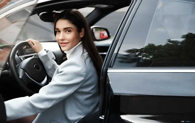 Ukrainian woman driving a car in Germany — symbol of simplified license exchange without exams