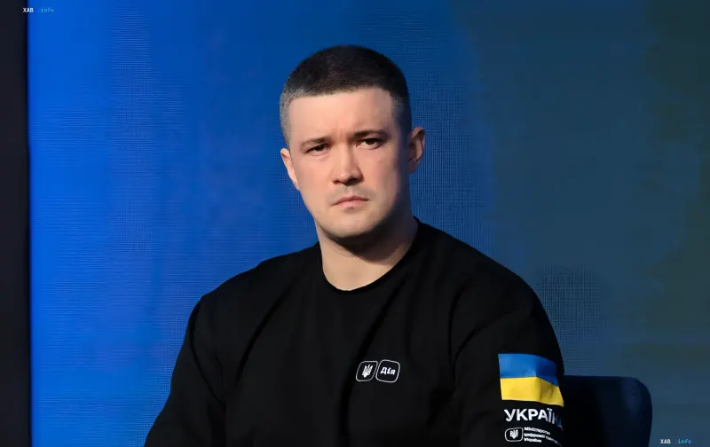 Mykhailo Fedorov, Ukraine's Minister of Digital Transformation, in a black t-shirt with the 'Diia' logo and Ukrainian flag