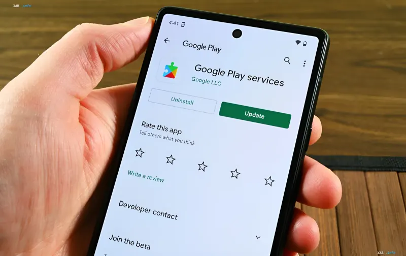 Smartphone showing Google Play Store with Google Play Services update screen, illustrating app store functionality amid EU sanctions on Russian services like VK and Max