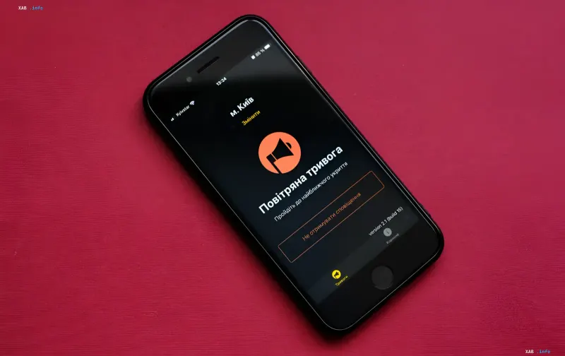 Smartphone displaying the 'Air Alert' app interface, a key component of Ukraine's civil air raid warning system