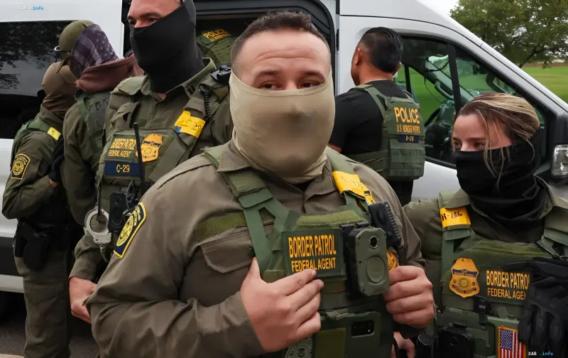US Border Patrol agents in tactical gear and masks, illustrating the enforcement measures under Trump's new strategy and ICE procurement plans.