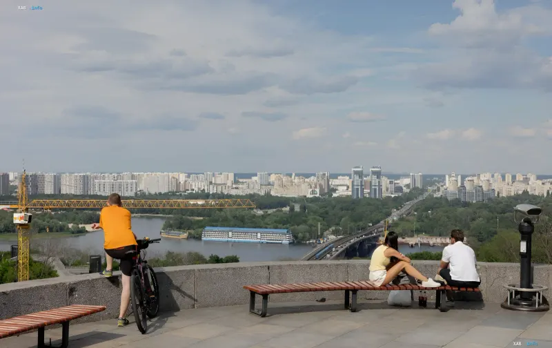 People relaxing on a viewing platform in Kyiv, enjoying the last warm days before the expected cooling and thunderstorms on August 12
