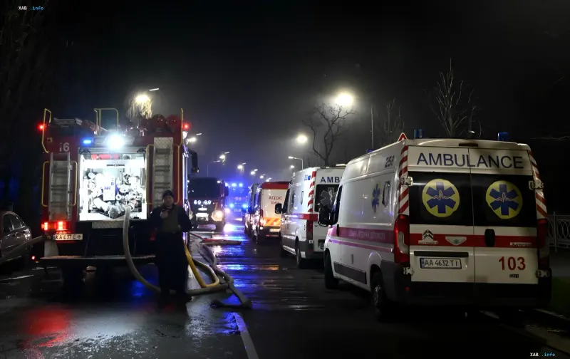 Fire trucks and ambulances at the scene of a drone attack in Manganec at night