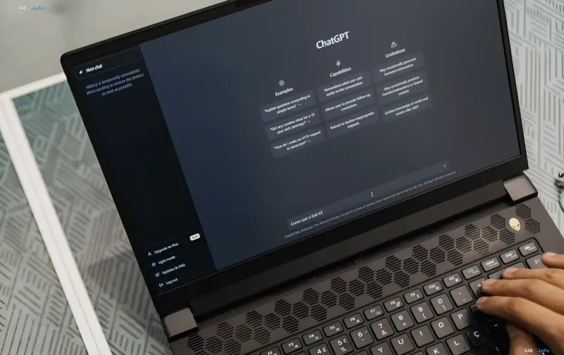 User typing a query into ChatGPT on a laptop: interface displays usage examples and model limitations, illustrating the Computer History for macOS topic