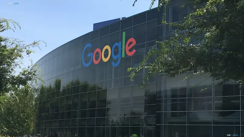 Google logo on the glass facade of a company office in the context of Australia's 2.5% tax on tech giants' advertising revenue