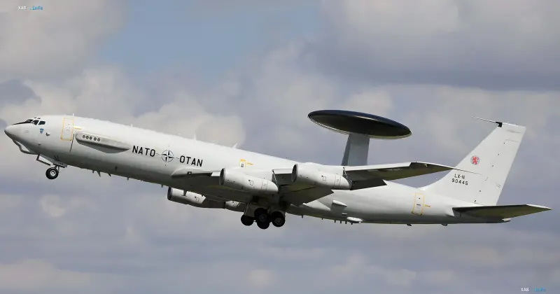 NATO signals-intelligence aircraft with a distinctive tail-mounted dish antenna in flight — part of the dual reconnaissance ring over the Black Sea and the Baltic
