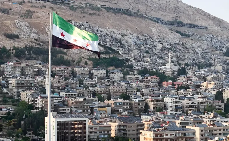 Syrian flag over Damascus as the US removes the state sponsor of terrorism designation