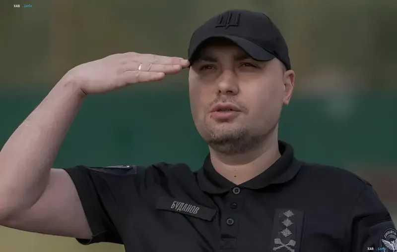 Kyrylo Budanov in military uniform saluting against a green background