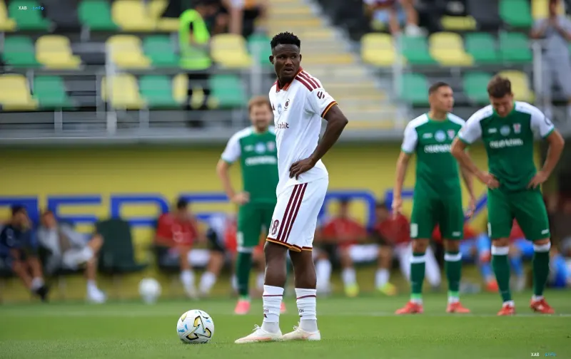 A Kharkiv player in white kit with the ball at his feet during the 5-0 UPL rout of Obolon
