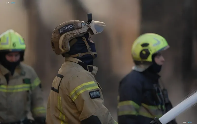 DSNS rescue workers in protective gear at the scene of a combined attack in Kyiv