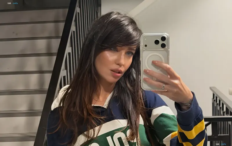 Nadia Dorofeeva takes a mirror selfie after regaining her voice