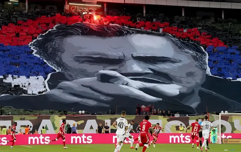 Giant banner with a portrait of Ratko Mladic on the stands of a Belgrade stadium during a football match