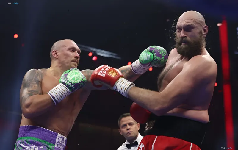 Oleksandr Usyk and Tyson Fury in the ring during their fight, context of Fury's trilogy call