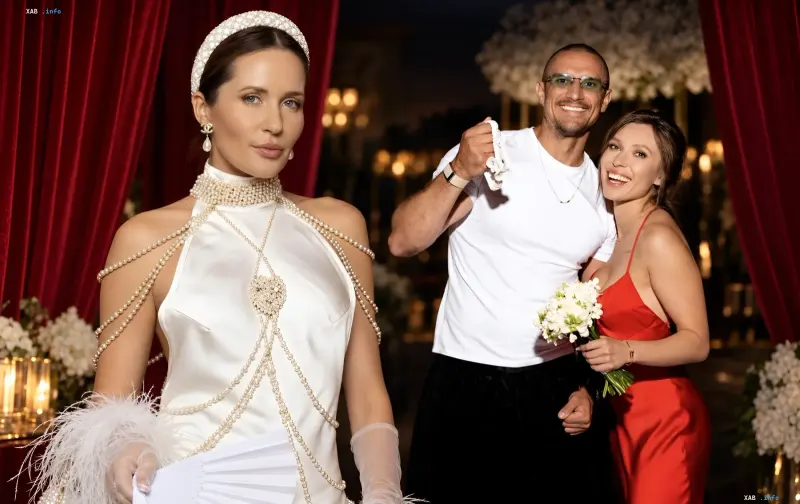 Natalja Denisenko in weißem Perlenkleid und Taras Tsymbalyuk mit Frau in Rot — Foto zum Bericht über die Trennung von Jelena Swytlizka