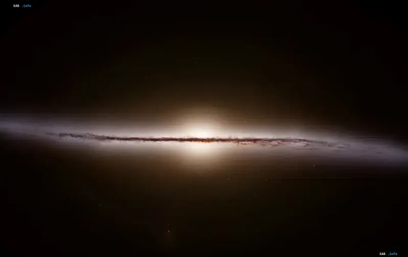 Galaxie Y1 von der Seite: helles Kerngebiet und ein Band aus überhitztem Staub im frühen Universum