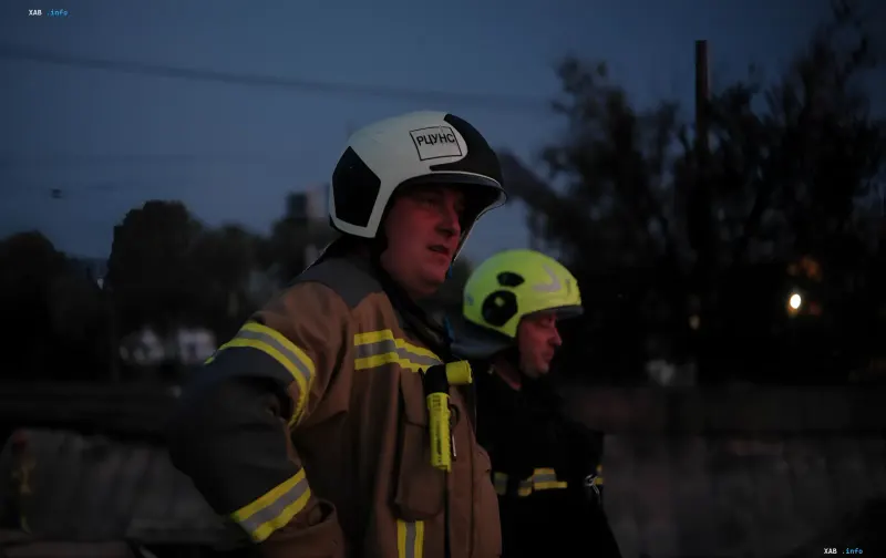 Rescue service personnel at the site of a nighttime drone attack on a nine-story building in Kyiv's Dniprovskyi district