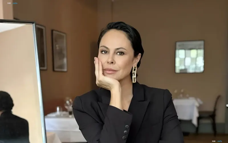 Natalia Egorova in a black blazer during her return to her native Ivano-Frankivsk region after 13 years