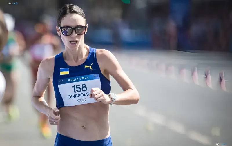 Lyudmyla Olyanovska competing in race walking in the Ukrainian national team kit