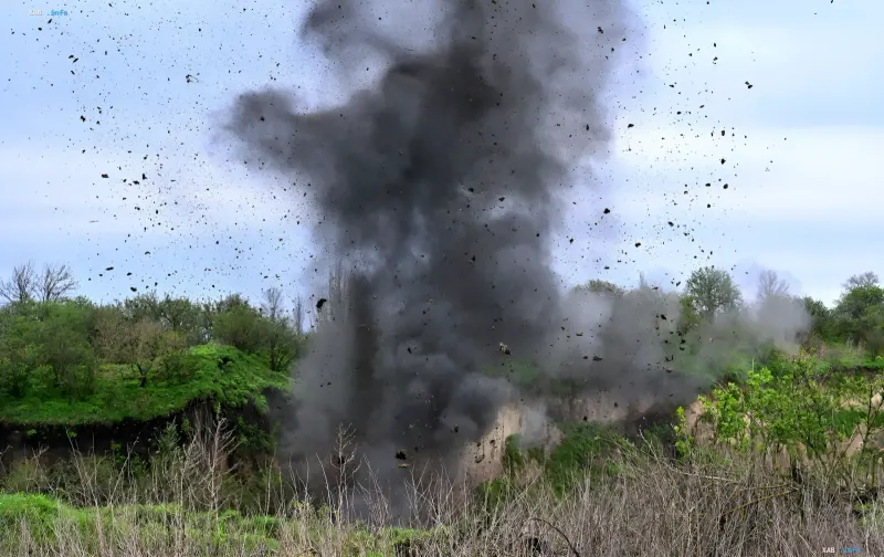 Massive plume of smoke and flying debris after a mass explosion at a granite quarry in Rivne Oblast
