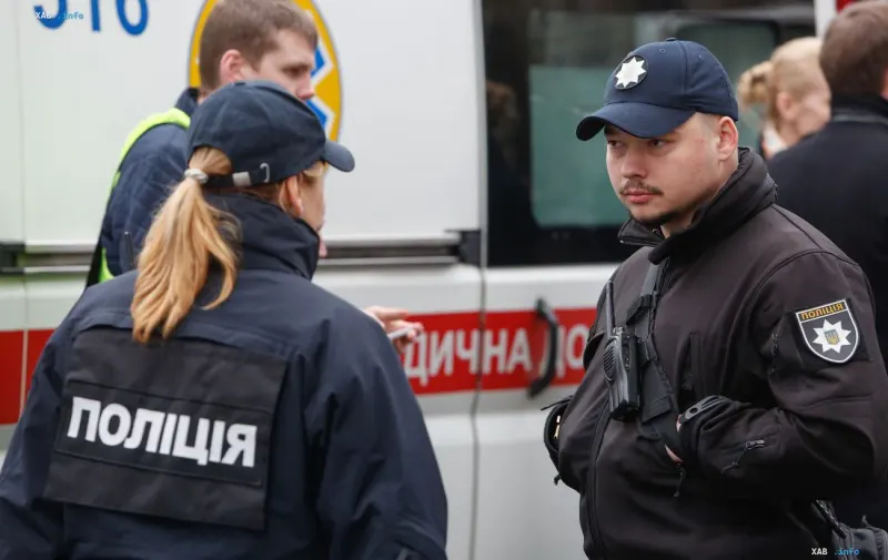Police officers at the scene of the September 23 attack on Kyiv: law enforcement coordinating near a service vehicle