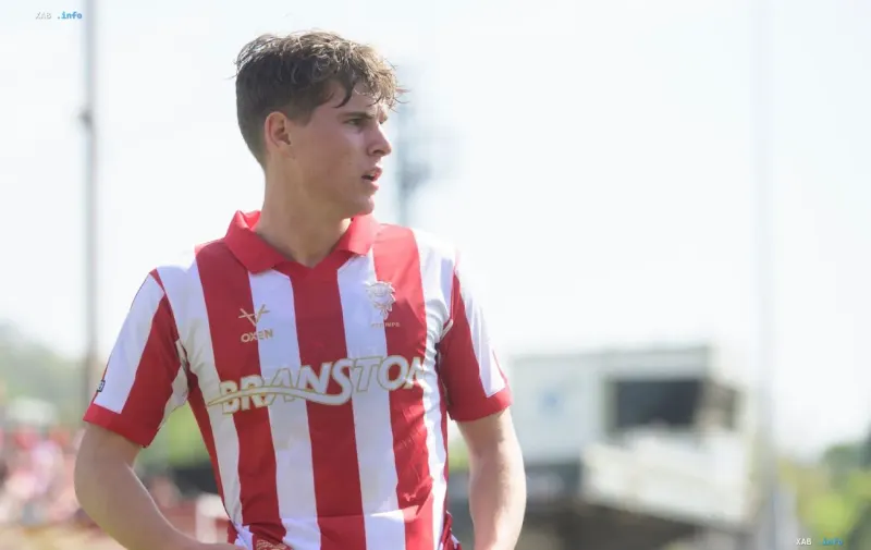 Ivan Varfolomeev in the red and white striped Lincoln City kit after extending his contract until summer 2030