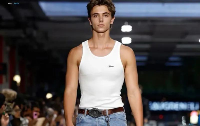 Sam Aspin, 20-year-old son of Britney Spears, on the runway in a white tank top and jeans — photo for the story about his fatigue with public judgments