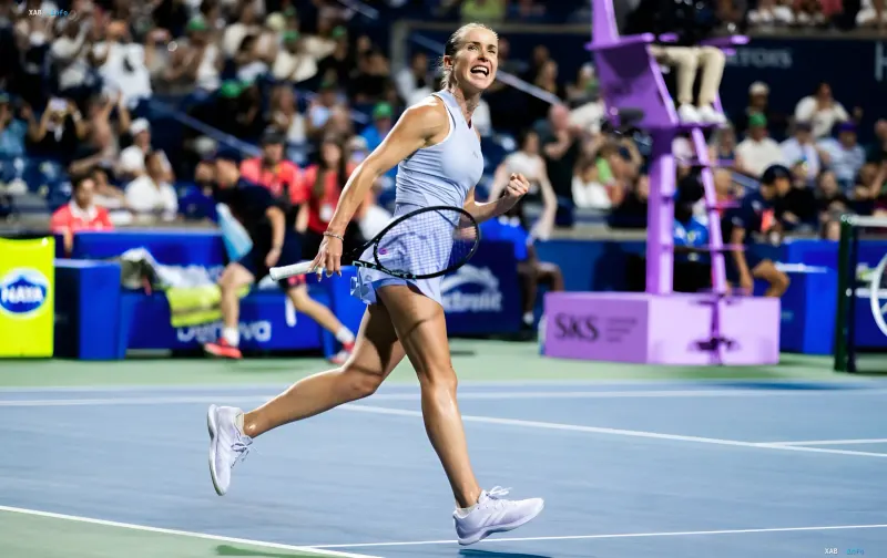 Ukrainian tennis player Elina Svitolina celebrates a victory on the hard court of a WTA tournament