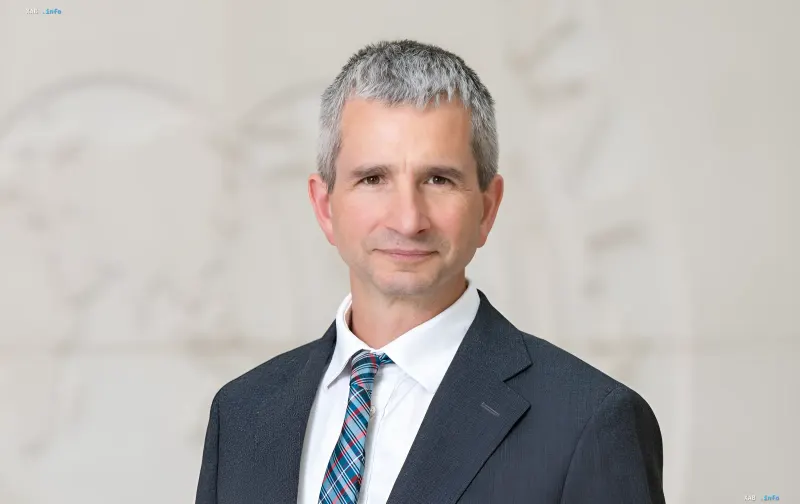 IMF European Department Director Mateusz Szczurek in a formal suit against a neutral background