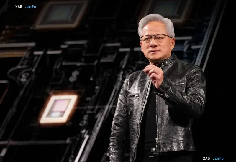 Nvidia CEO Jensen Huang speaking at a presentation wearing his signature leather jacket