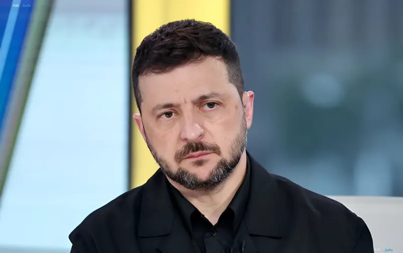 Volodymyr Zelenskyy with a serious expression at an indoor official meeting