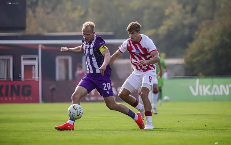 Two football players fighting for the ball during a Ukrainian Premier League match