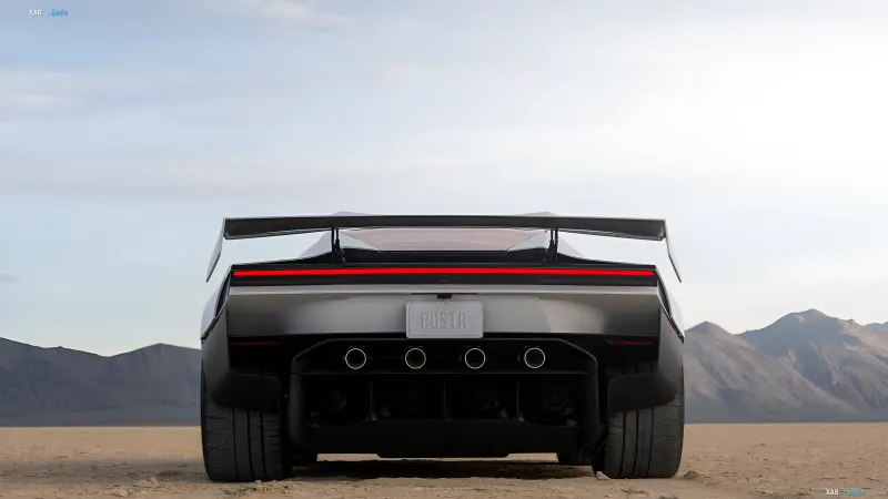 Rear view of the Tesla Roadster sports car at a desert testing ground