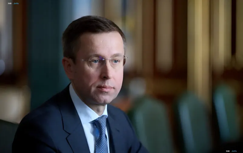 Prime Minister of Ukraine Serhiy Koretsky speaking at an official meeting in a formal suit.