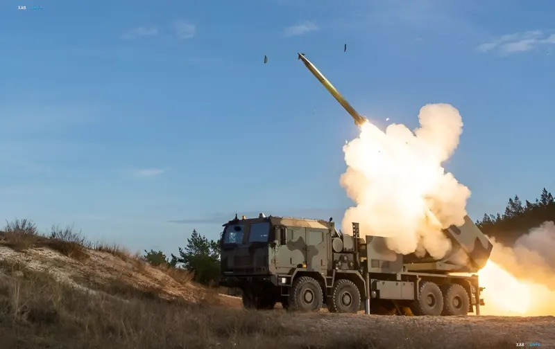 Rocket launch from a Homar-K multiple launch rocket system in a field setting
