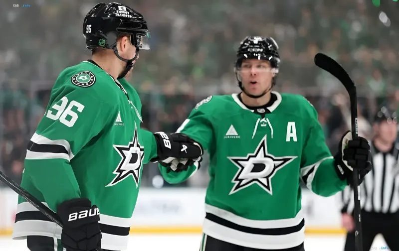 Dallas Stars players in green jerseys exchange handshakes during a hockey game.