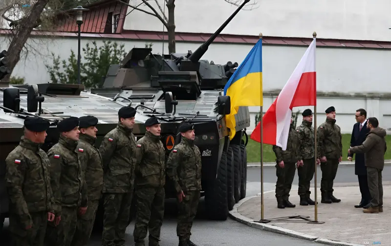 Ukrainian and Polish flags next to armored vehicles and military personnel during an official meeting
