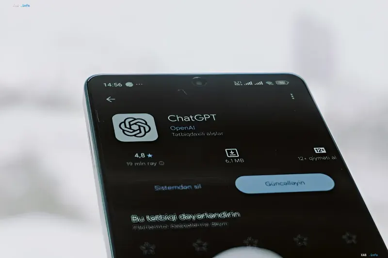 Smartphone in hands displaying the OpenAI ChatGPT mobile application interface on screen