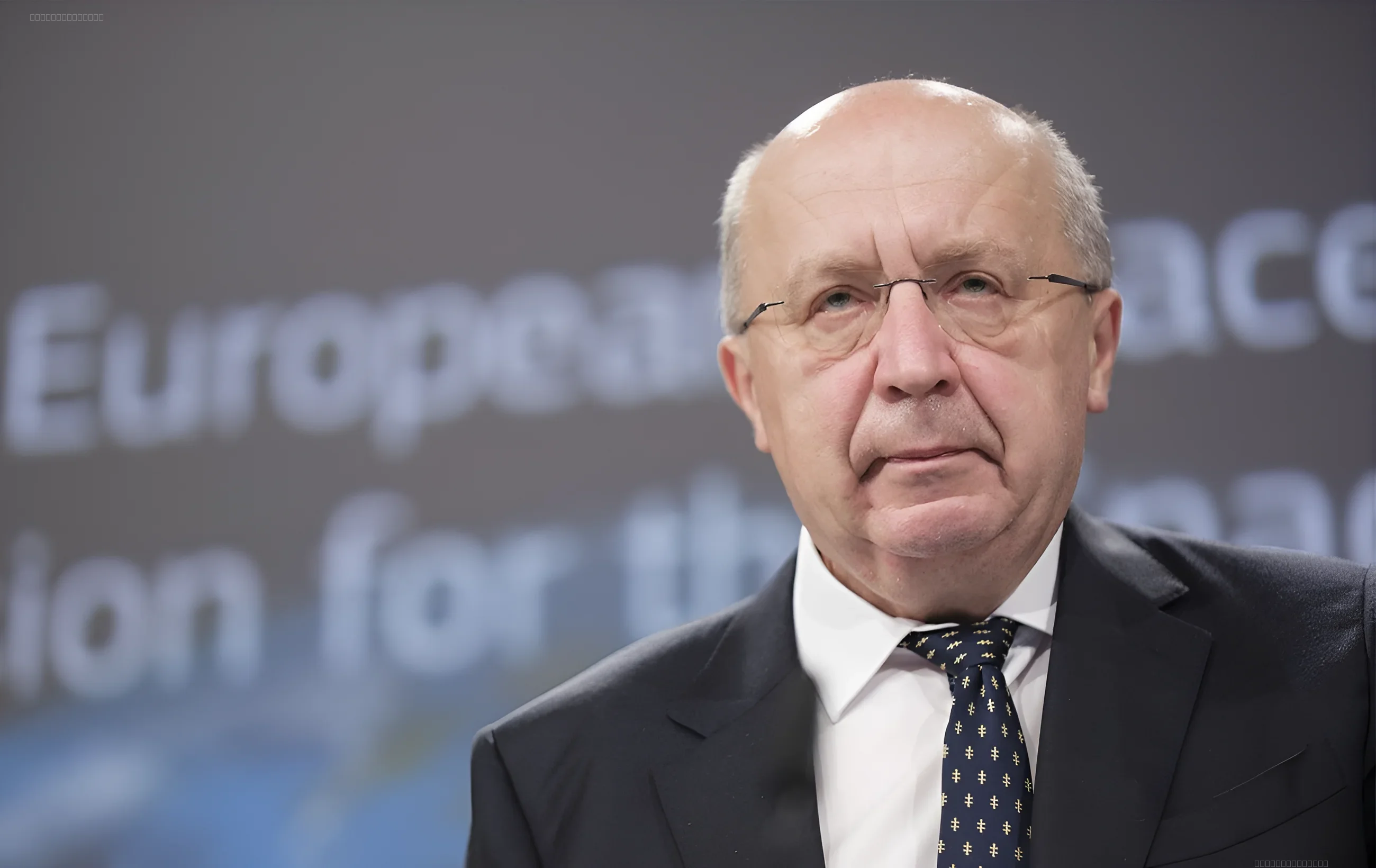 European Commissioner for Defence Andrius Kubilius in front of the European Commission logo