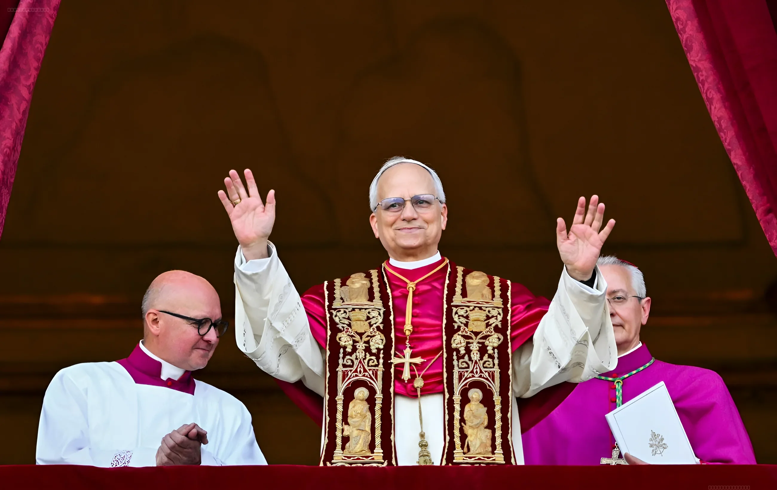 Pope Leo XIV waving from the Vatican balcony during a speech about the war in Ukraine