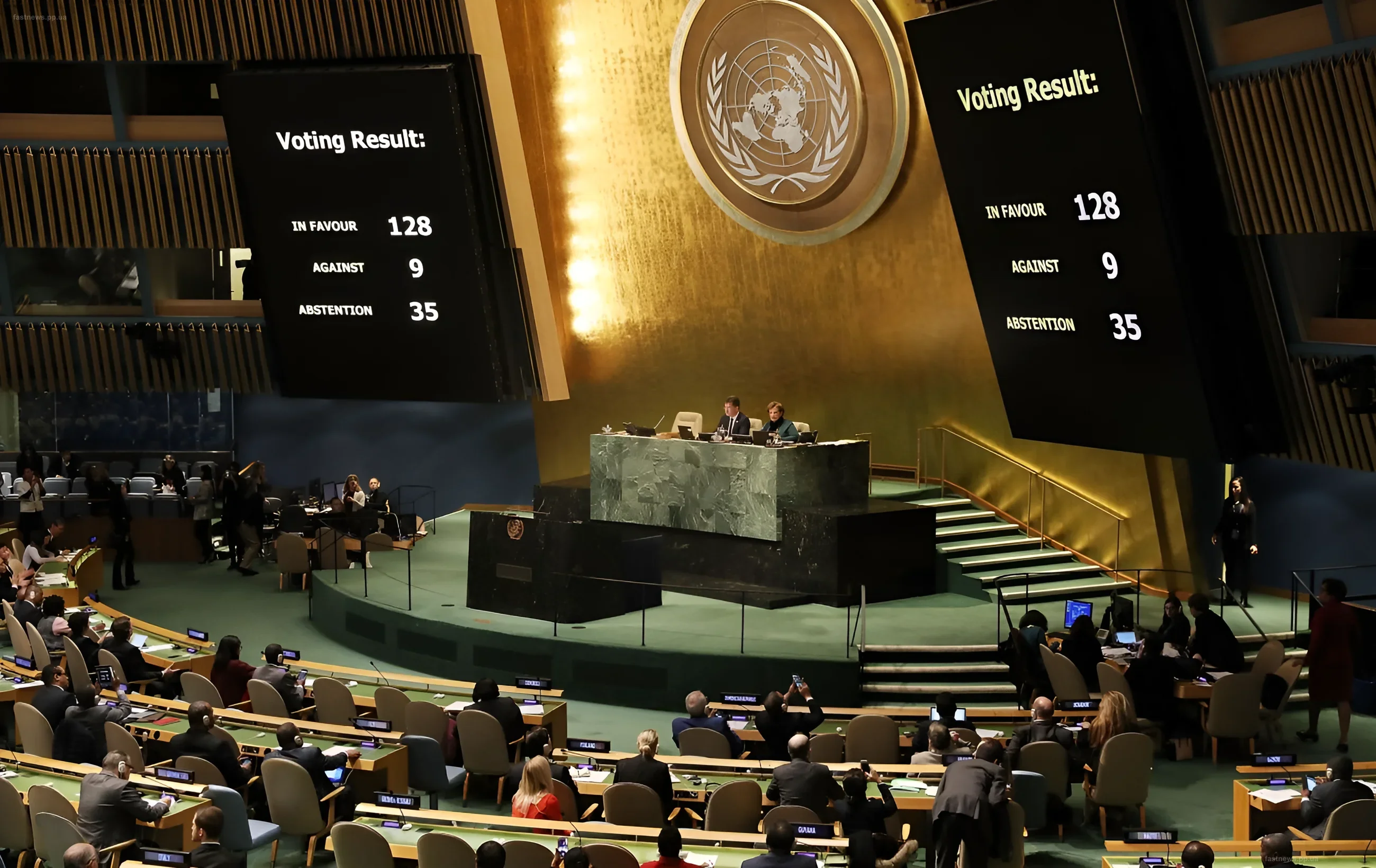 UN Security Council session with voting result screens and the organization's emblem in the background