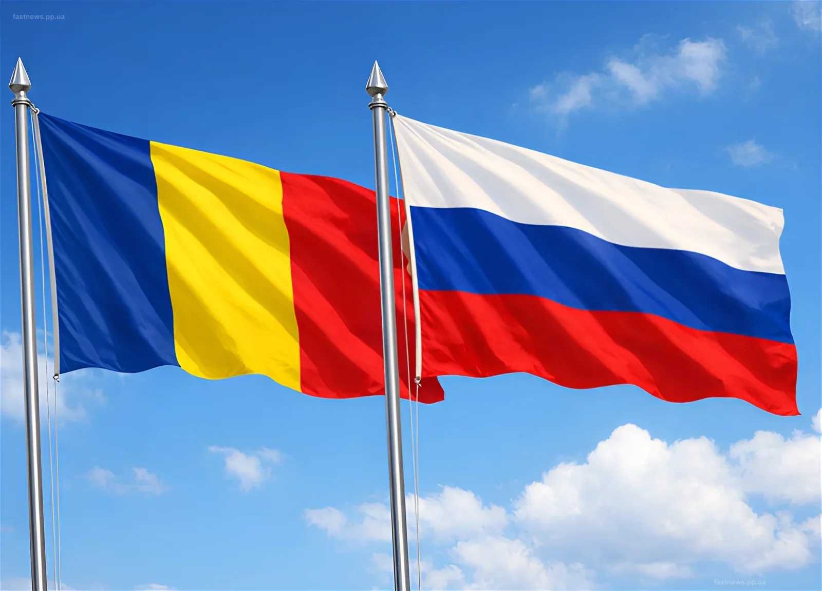 Flags of Russia and Romania against a blue sky, symbolizing diplomatic relations