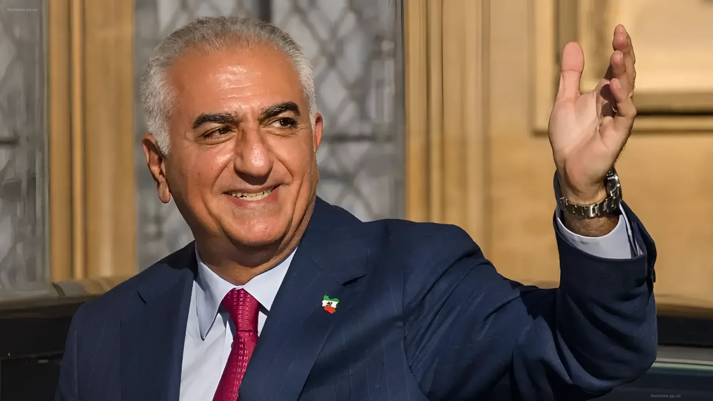 Reza Pahlavi, heir to the Iranian throne, smiles and waves during his visit to Odesa