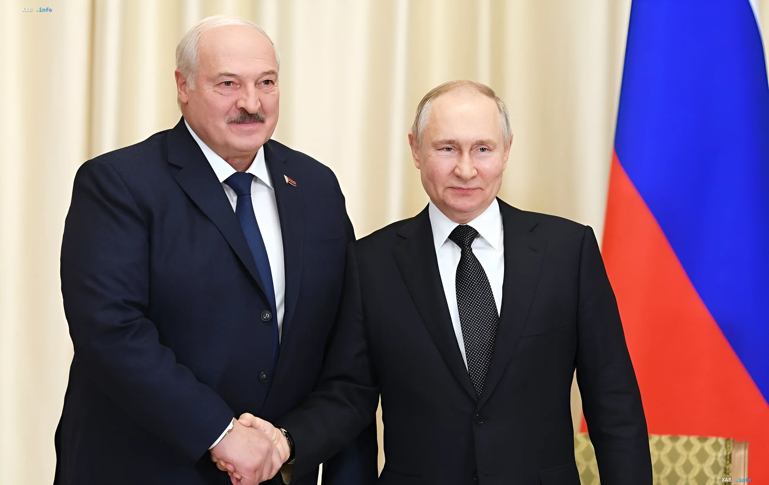 Alexander Lukashenko and Vladimir Putin shaking hands against the backdrop of the Russian flag — symbol of Belarus-Russia strategic alliance in the context of military and technological threats