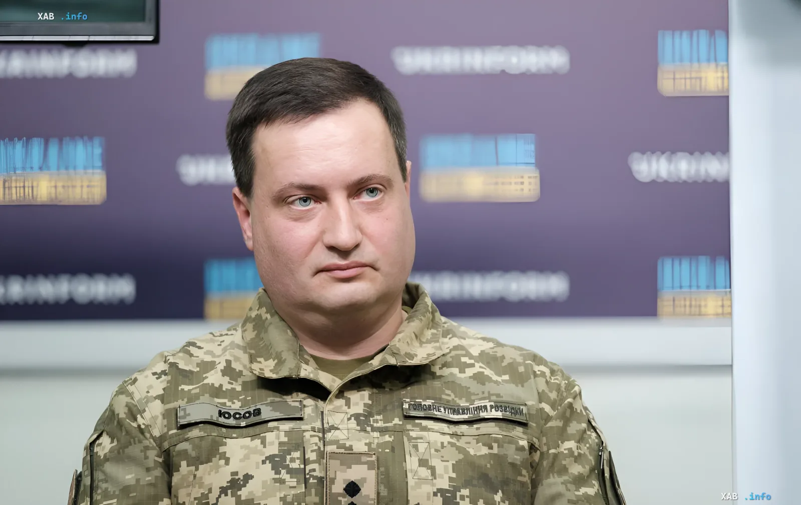 Kyrylo Yusov, official spokesperson of Ukraine’s Main Directorate of Intelligence (GUR), pictured against the GUR logo, illustrating the theme of psychological warfare and Russian delay tactics